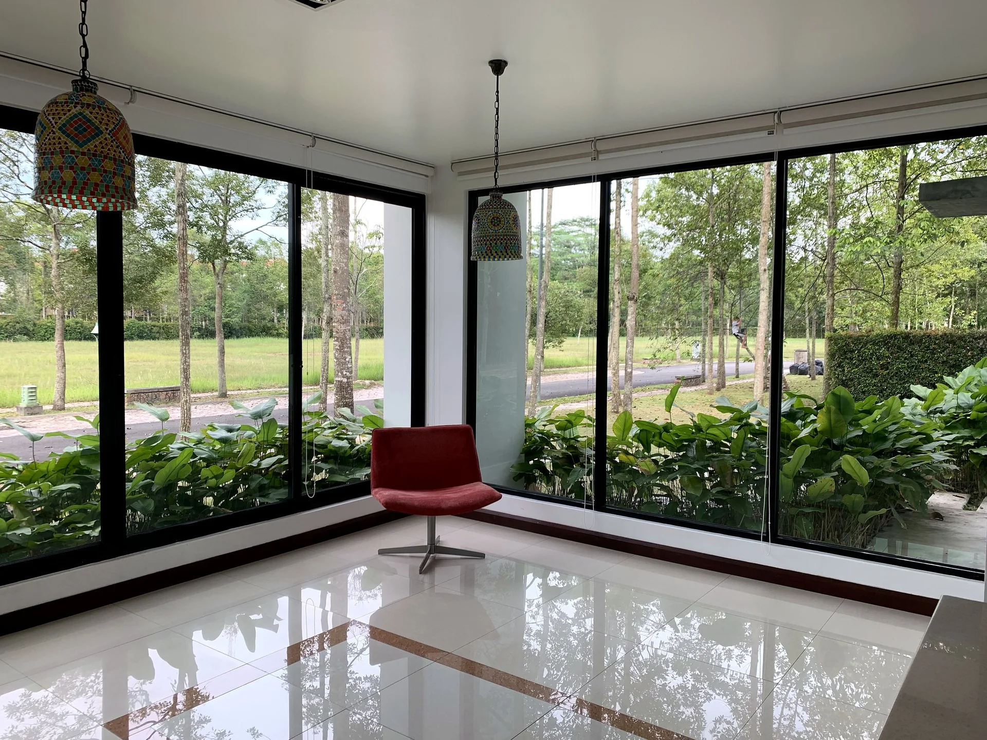 Light-filled room overlooking estate greenery